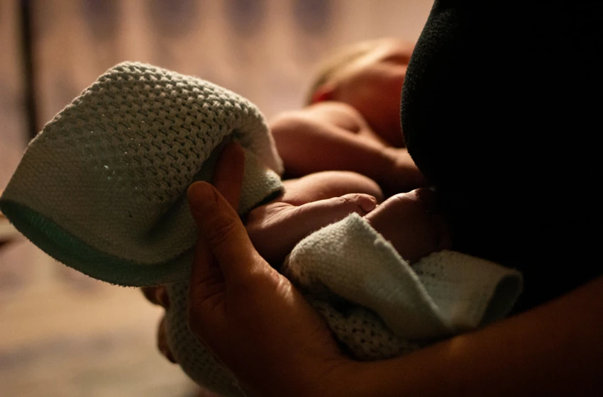 A close up of a newborn baby's feet