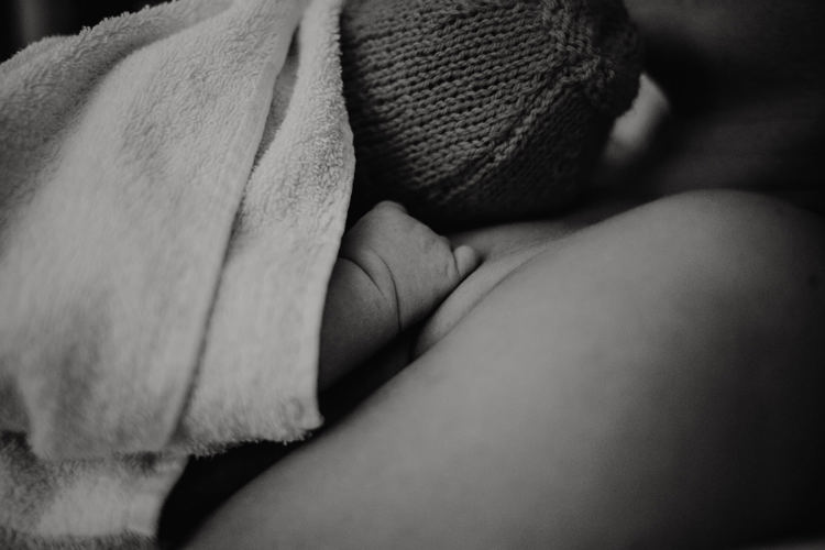 A close up of a newborn baby's hand