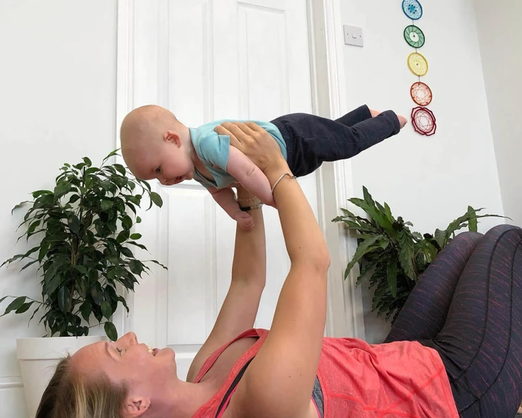 Sinead doing yoga with her son